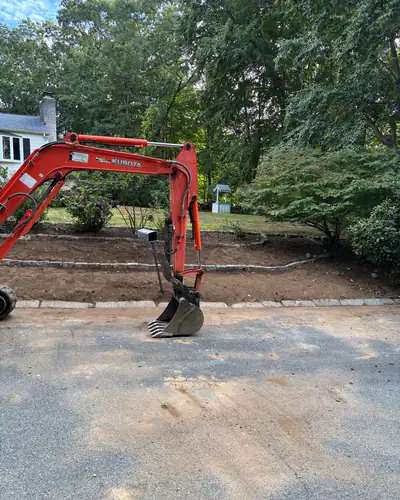 After: two tiers of beds edged in cobblestone