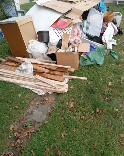 Boards, boxes and furniture from a cleanout