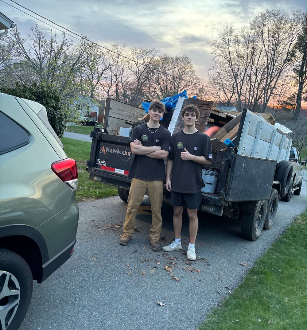 The K. Ferreira’s crew in front of a full dump trailer