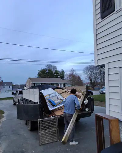Loading furniture into the trailer at a home