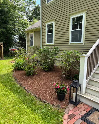 After: fresh mulch beside the back steps
