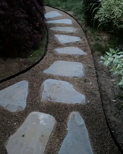 After: flagstone stepping stones set in pea stone